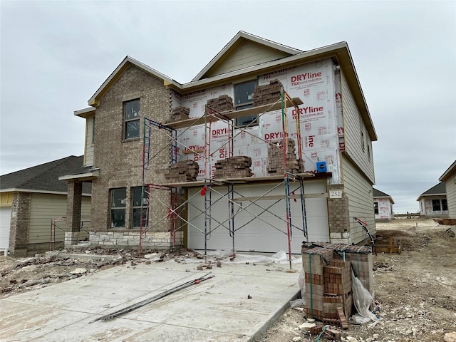 property in mid-construction with a garage