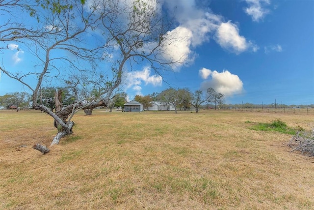 view of yard with a rural view