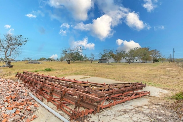 view of yard with a rural view