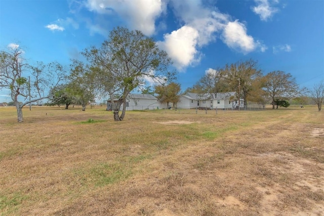 view of yard with a rural view