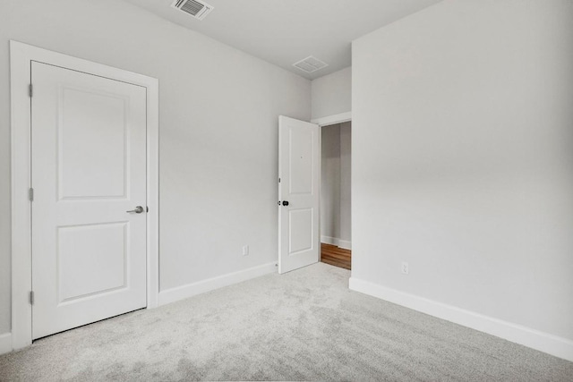 unfurnished bedroom with light carpet