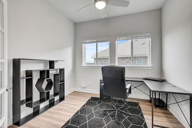 office space with hardwood / wood-style floors and ceiling fan