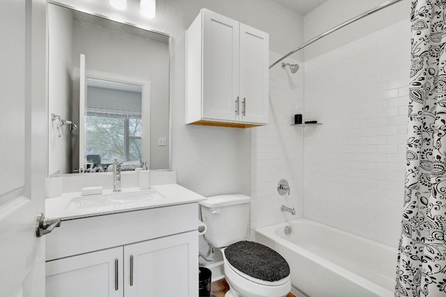 full bathroom featuring vanity, toilet, and tiled shower / bath combo