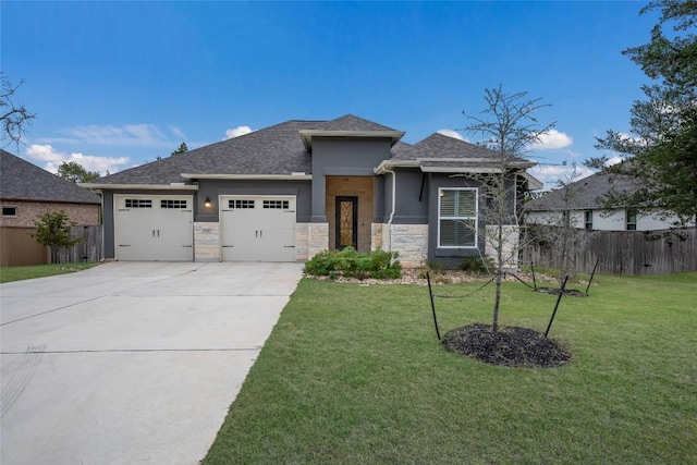 prairie-style house with a front yard and a garage