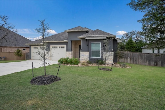 view of front of property featuring a front lawn and a garage