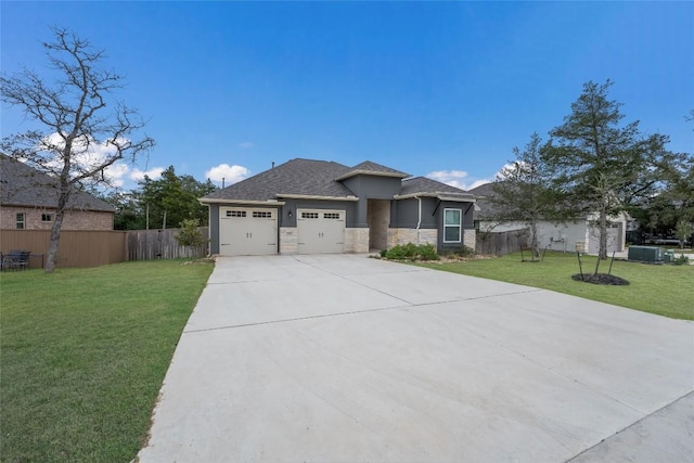 view of front facade featuring a front lawn and a garage