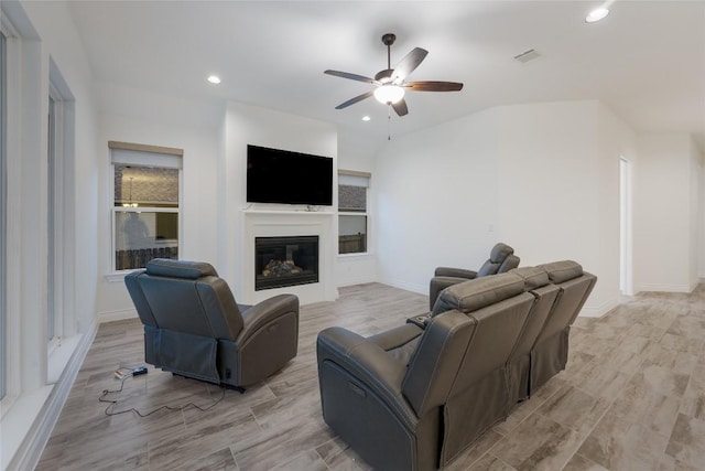 living room featuring ceiling fan and light hardwood / wood-style flooring