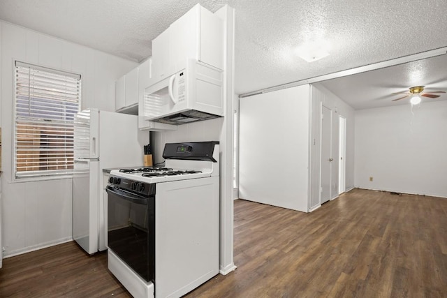 kitchen with white cabinets, dark hardwood / wood-style flooring, white appliances, and a textured ceiling