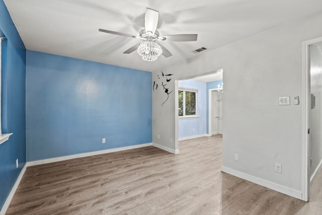 spare room with light hardwood / wood-style flooring and ceiling fan