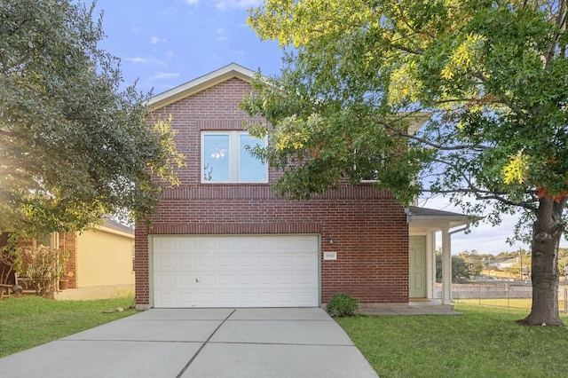 view of front of property featuring a garage and a front lawn