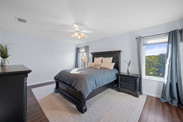 bedroom featuring ceiling fan and dark hardwood / wood-style floors