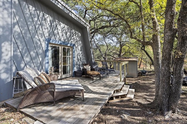 wooden deck with a storage shed