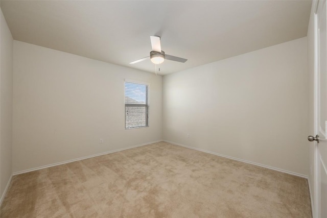 unfurnished room featuring light colored carpet and ceiling fan