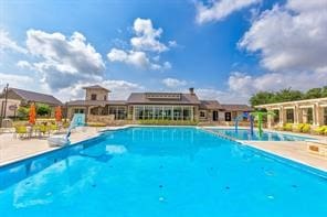 view of swimming pool featuring a patio area