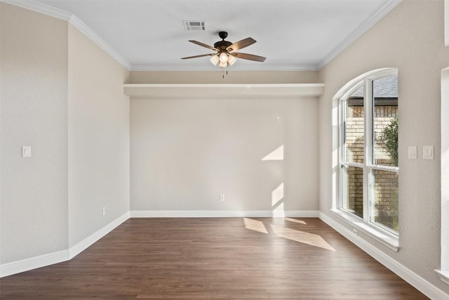 empty room with crown molding, dark hardwood / wood-style flooring, and ceiling fan