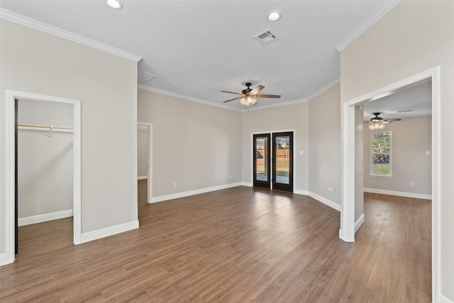 unfurnished living room featuring wood-type flooring, french doors, ornamental molding, and ceiling fan