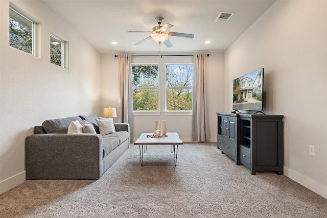 carpeted living area featuring ceiling fan, visible vents, baseboards, and recessed lighting