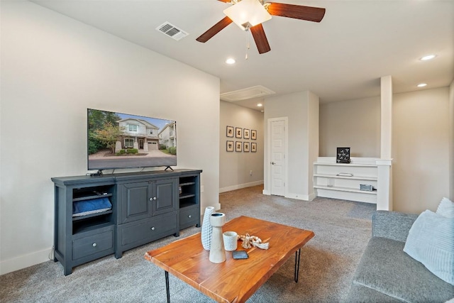 carpeted living room with ceiling fan