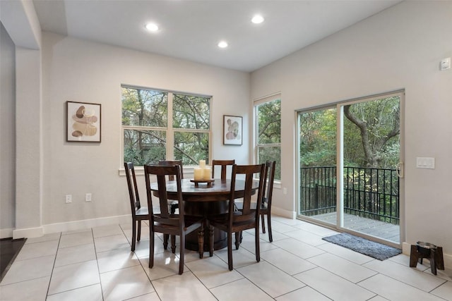 dining space with light tile patterned flooring, baseboards, and recessed lighting