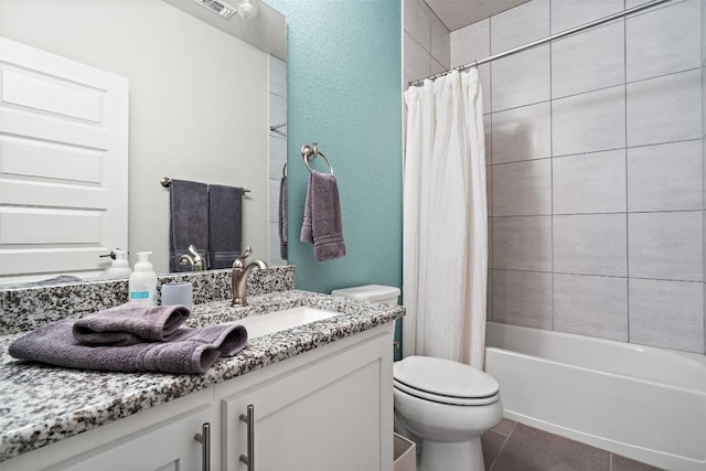 full bathroom featuring visible vents, toilet, shower / tub combo, vanity, and tile patterned flooring