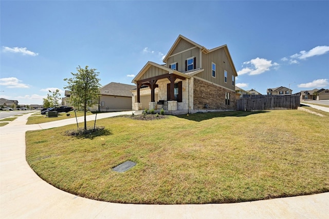 view of front of home with a front yard and covered porch