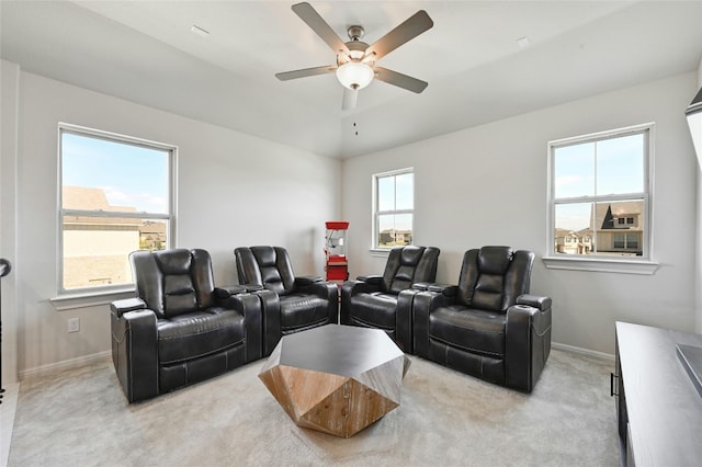 cinema with light colored carpet and ceiling fan