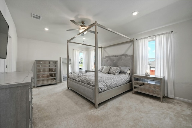 bedroom featuring light carpet and ceiling fan