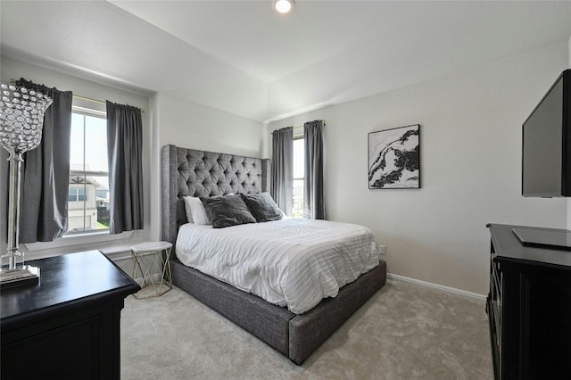 carpeted bedroom with multiple windows