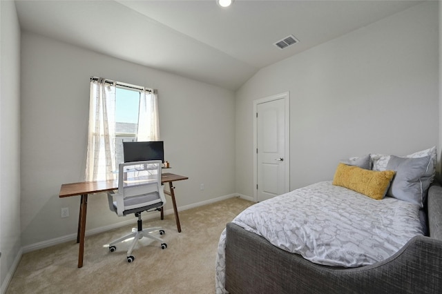 carpeted bedroom with vaulted ceiling