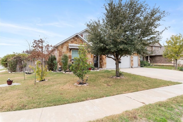 obstructed view of property with a garage and a front lawn