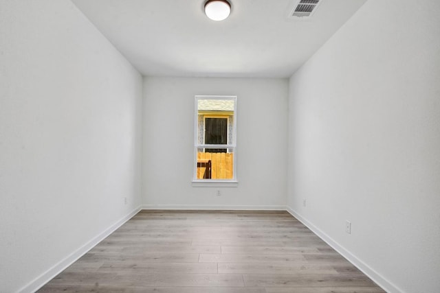 596 Biscayne Bay Bnd, Kyle, TX 78640 - spare room with wood finished floors, visible vents, and baseboards