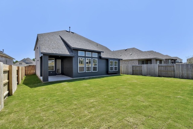 596 Biscayne Bay Bnd, Kyle, TX 78640 - rear view of property with a yard, roof with shingles, a patio, and a fenced backyard