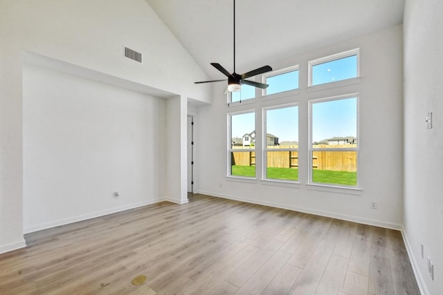 596 Biscayne Bay Bnd, Kyle, TX 78640 - spare room with high vaulted ceiling, a ceiling fan, wood finished floors, baseboards, and visible vents