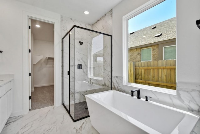 596 Biscayne Bay Bnd, Kyle, TX 78640 - full bathroom featuring a spacious closet, a freestanding tub, marble finish floor, and a marble finish shower