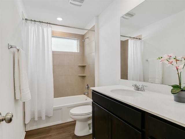 full bathroom featuring shower / tub combo, vanity, toilet, and hardwood / wood-style floors