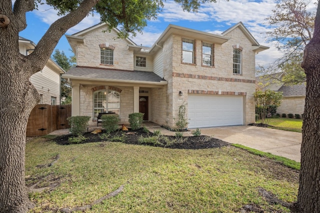 front of property featuring a garage and a front lawn