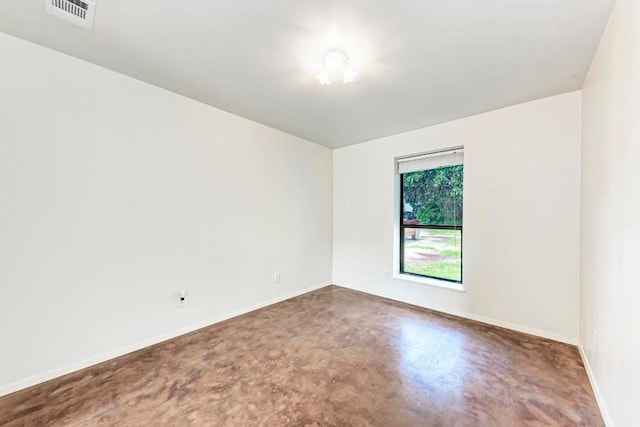 spare room with concrete floors