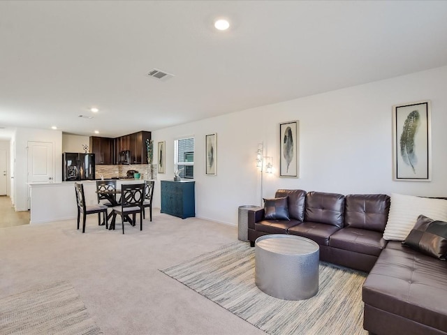 40 Trinity Cir, Lockhart, TX 78644 - living area featuring light colored carpet, recessed lighting, and baseboards