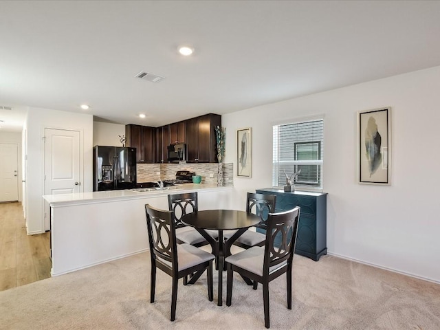 40 Trinity Cir, Lockhart, TX 78644 - dining space with light colored carpet, recessed lighting, and baseboards