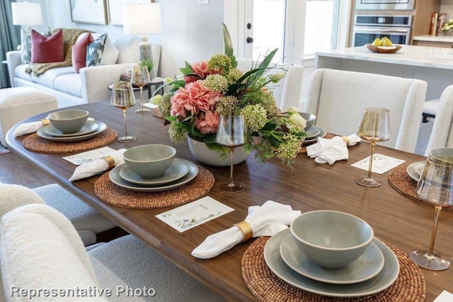 dining area with hardwood / wood-style flooring