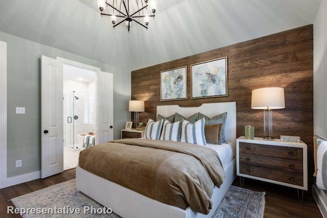 bedroom with dark wood-type flooring, wooden walls, and an inviting chandelier