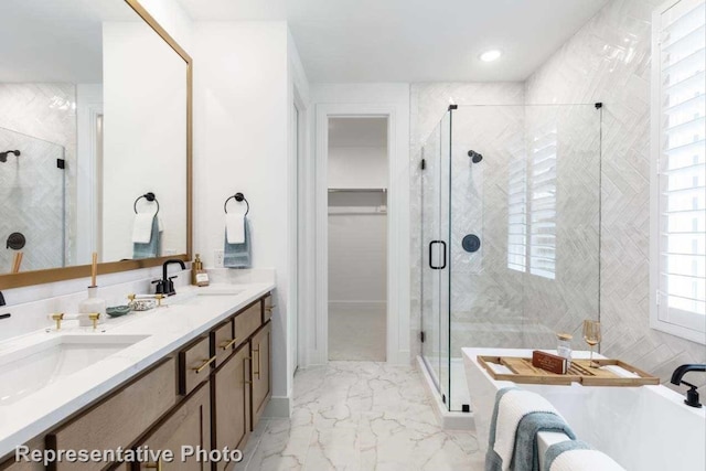 bathroom with vanity and independent shower and bath