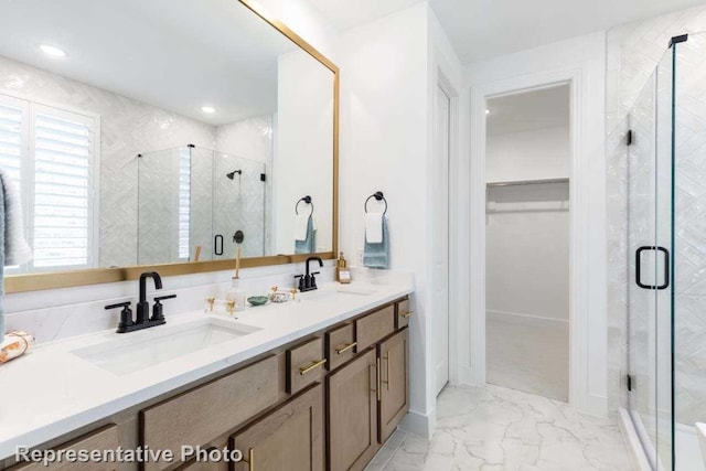 bathroom featuring vanity and an enclosed shower