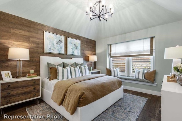 bedroom featuring a notable chandelier, lofted ceiling, dark wood-type flooring, and wooden walls