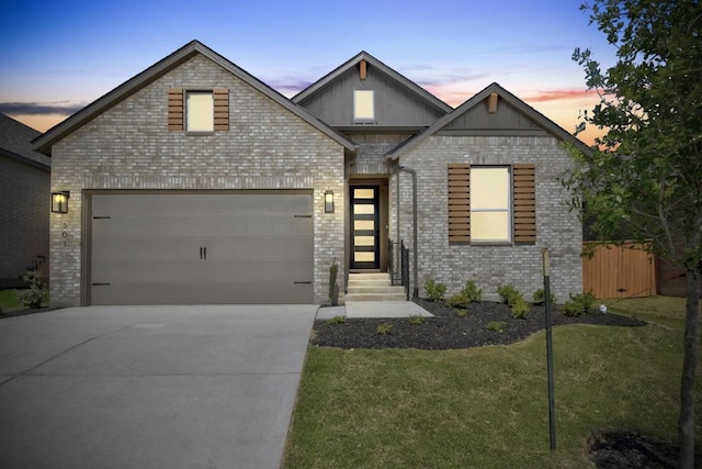564 Biscayne Bay Bnd, Kyle, TX 78640 - view of front of property featuring driveway, board and batten siding, a garage, and brick siding