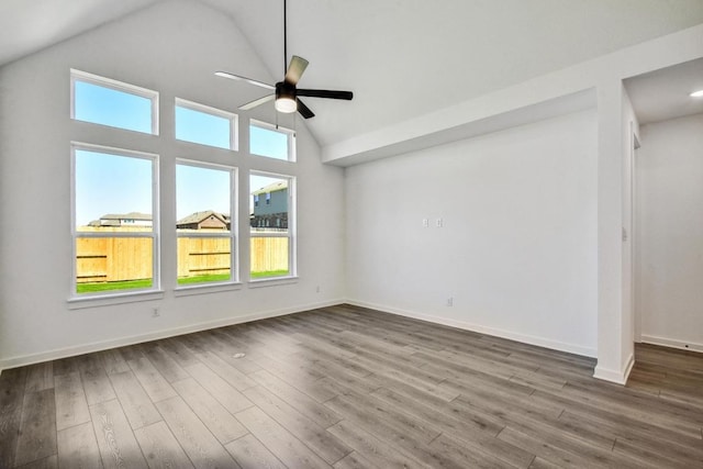 564 Biscayne Bay Bnd, Kyle, TX 78640 - empty room featuring ceiling fan, dark wood-type flooring, baseboards, and high vaulted ceiling
