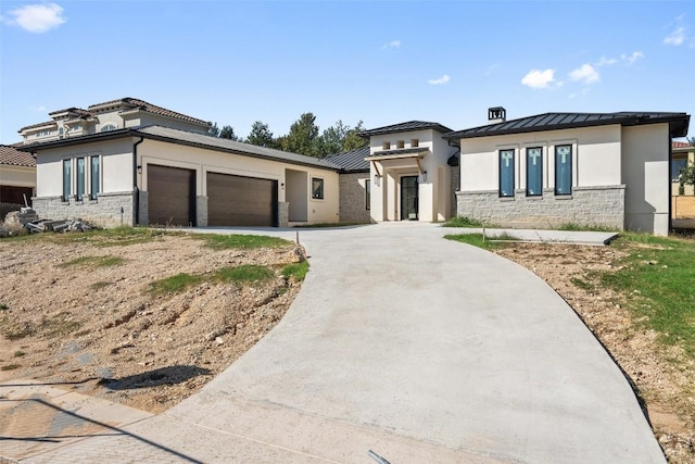 prairie-style home featuring a garage