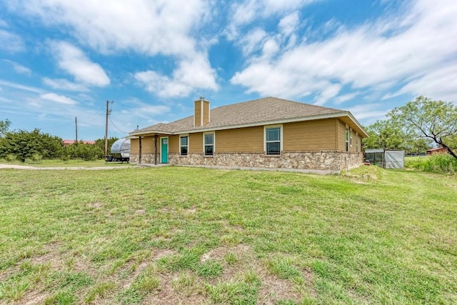 back of house with a yard