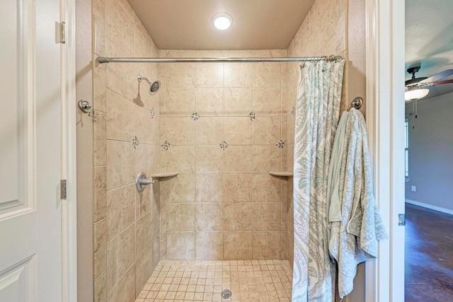 bathroom with a shower with shower curtain and ceiling fan