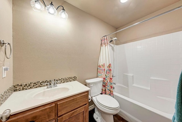 full bathroom featuring shower / tub combo with curtain, vanity, and toilet